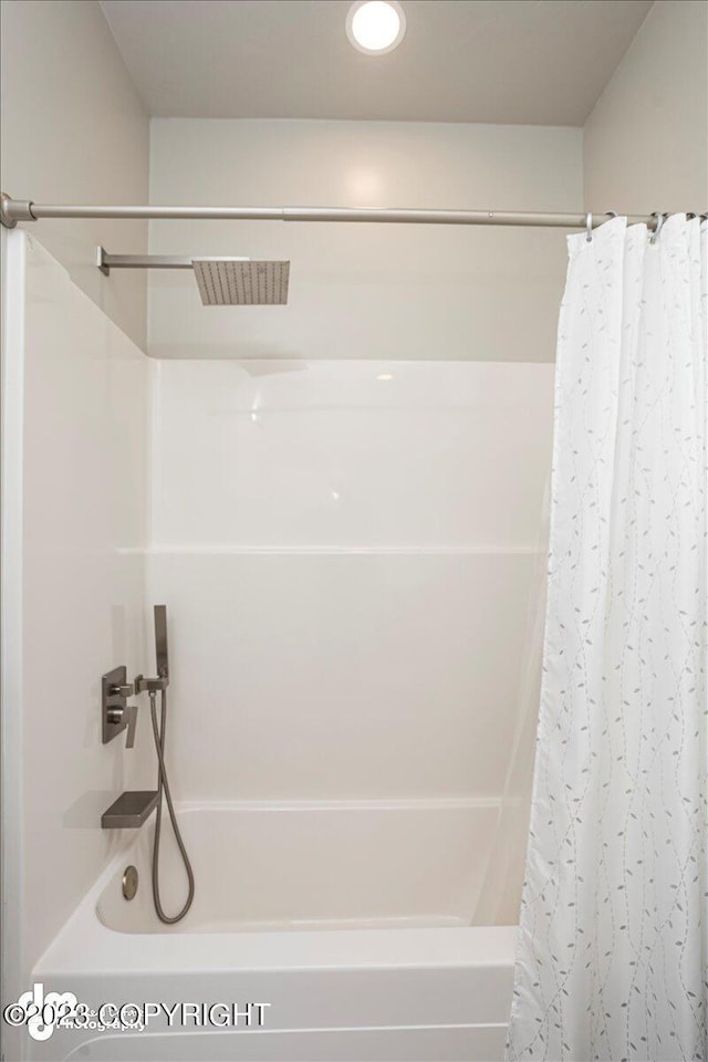 bathroom with visible vents and shower / bath combination with curtain