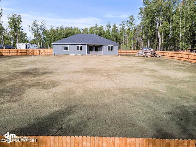 view of yard with a fenced backyard