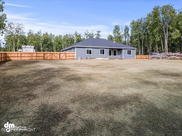 back of property with fence