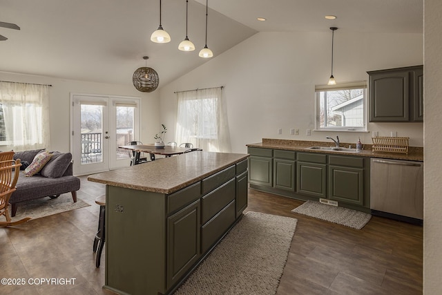 kitchen with a kitchen island, lofted ceiling, a sink, french doors, and dishwasher