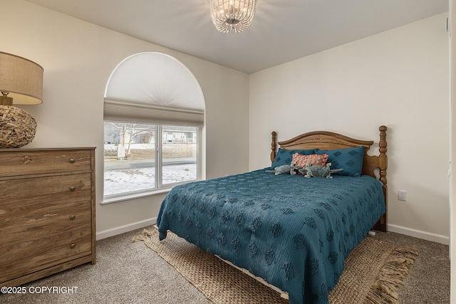 bedroom with carpet flooring and baseboards