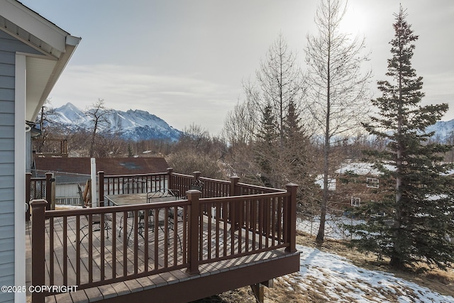 wooden deck with a mountain view