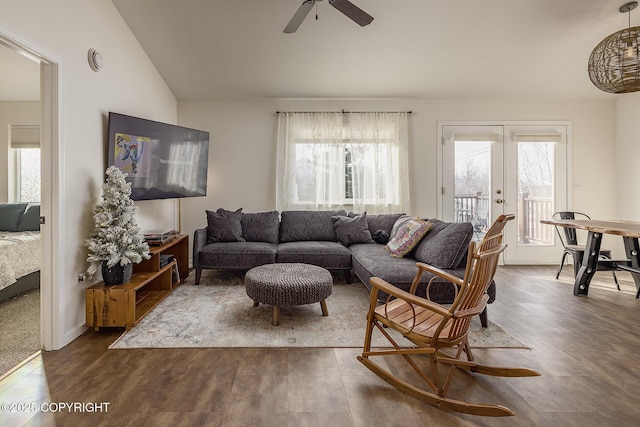 living area featuring vaulted ceiling, french doors, wood finished floors, and a wealth of natural light