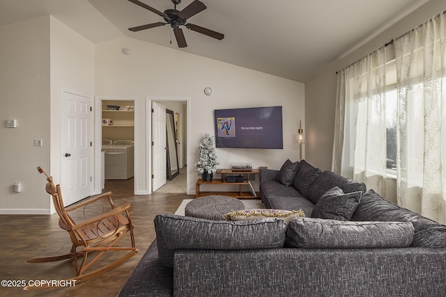 living area with a ceiling fan, wood finished floors, baseboards, high vaulted ceiling, and independent washer and dryer