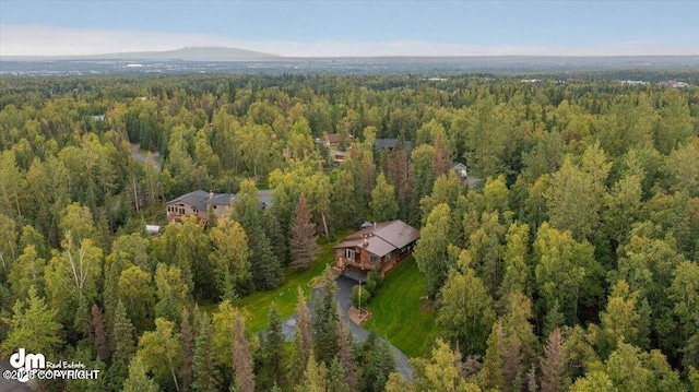 drone / aerial view featuring a forest view