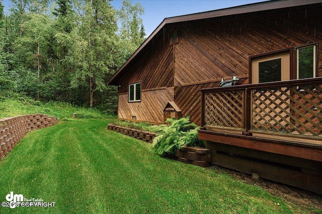 view of home's exterior with crawl space and a lawn