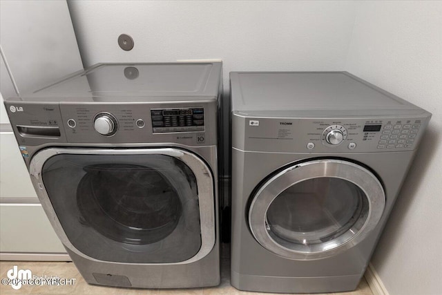 laundry area featuring laundry area and washing machine and dryer