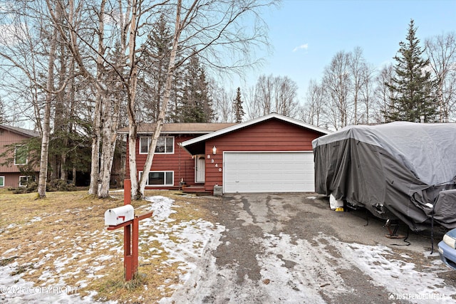 view of front of property with driveway and an attached garage