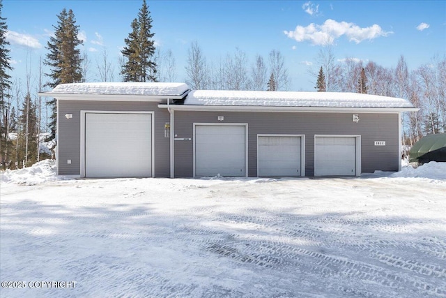 3035 Treaty St, North Pole, AK 99705 - view of snow covered garage