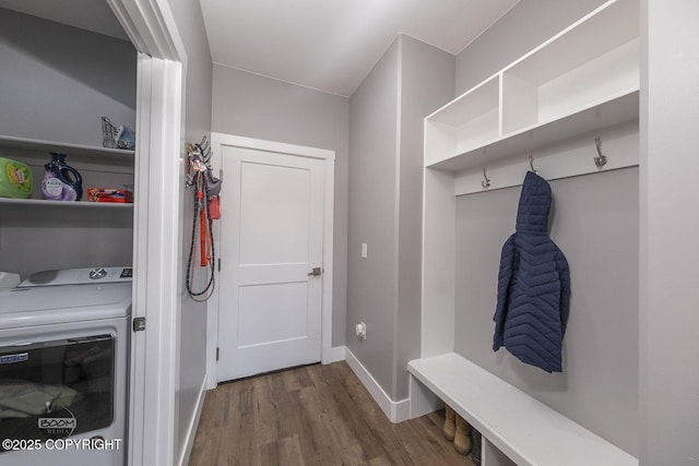 mudroom featuring dark wood-style floors, baseboards, and separate washer and dryer