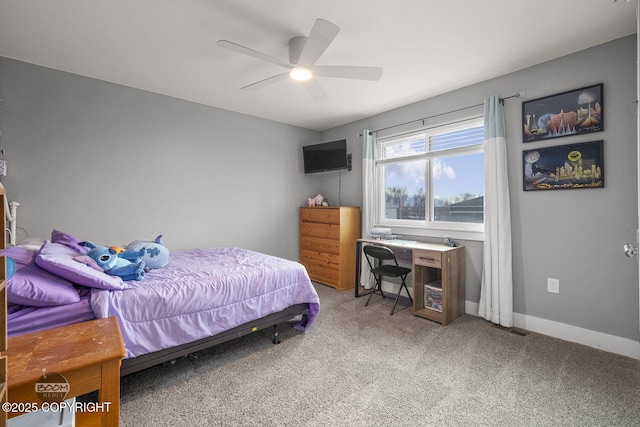 carpeted bedroom featuring ceiling fan and baseboards