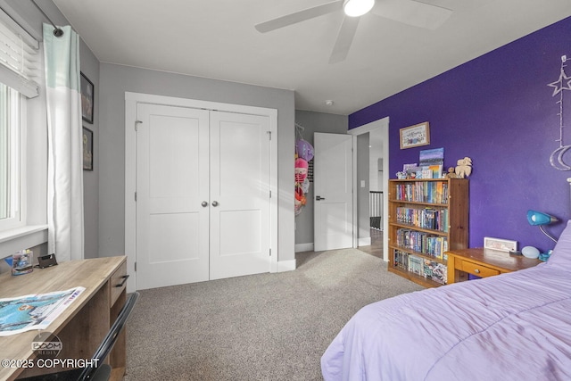 bedroom with ceiling fan, a closet, and carpet flooring