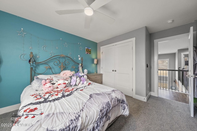 bedroom with a closet, carpet flooring, a ceiling fan, and baseboards