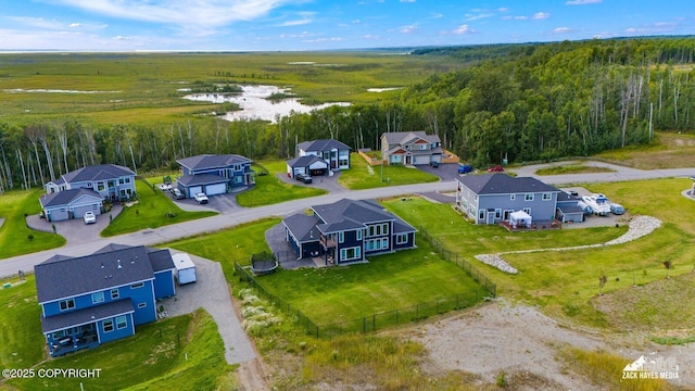 bird's eye view featuring a residential view and a view of trees