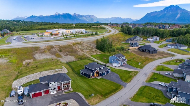 bird's eye view with a residential view and a mountain view