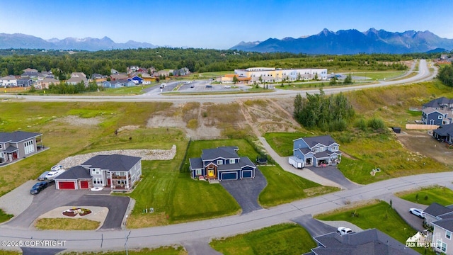 birds eye view of property with a residential view and a mountain view