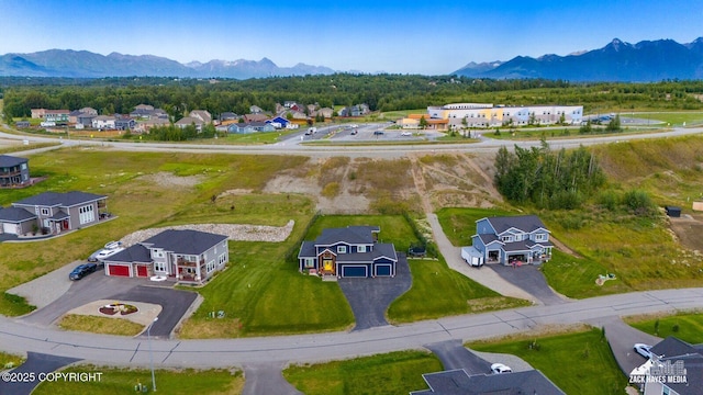 bird's eye view with a residential view and a mountain view