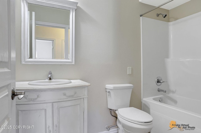 bathroom featuring shower / bath combination, toilet, and vanity