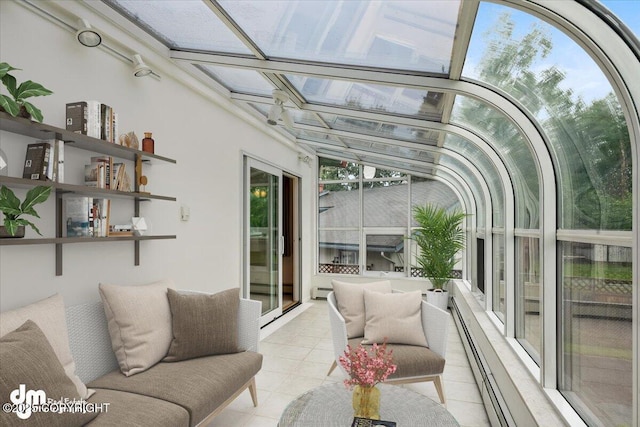 sunroom featuring a baseboard heating unit