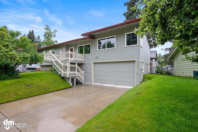 view of front of house with stairway, an attached garage, concrete driveway, and a front lawn