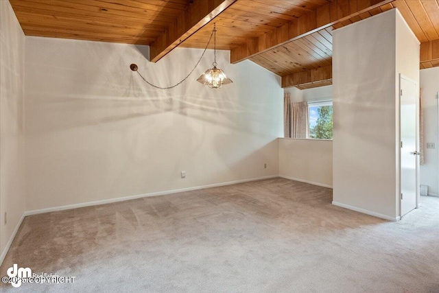 carpeted spare room with an inviting chandelier, wood ceiling, lofted ceiling with beams, and baseboards