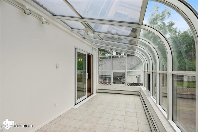 unfurnished sunroom featuring a baseboard radiator and baseboard heating