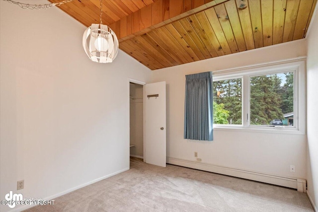 carpeted empty room with a baseboard radiator, baseboards, wood ceiling, and vaulted ceiling