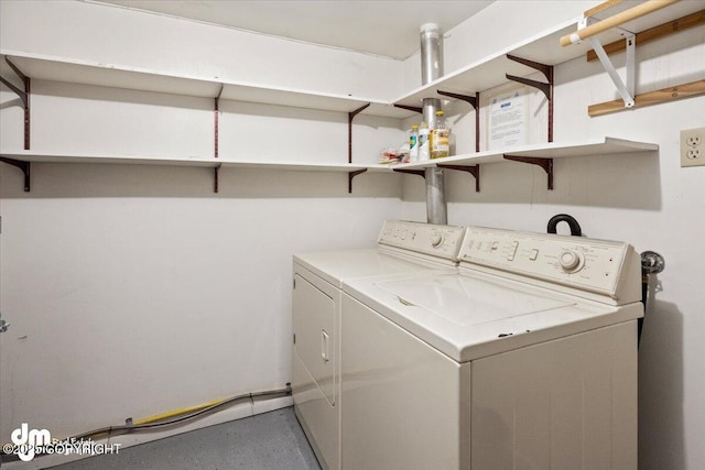 washroom featuring laundry area and separate washer and dryer