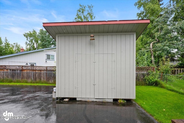 view of shed featuring a fenced backyard