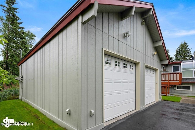 garage with aphalt driveway