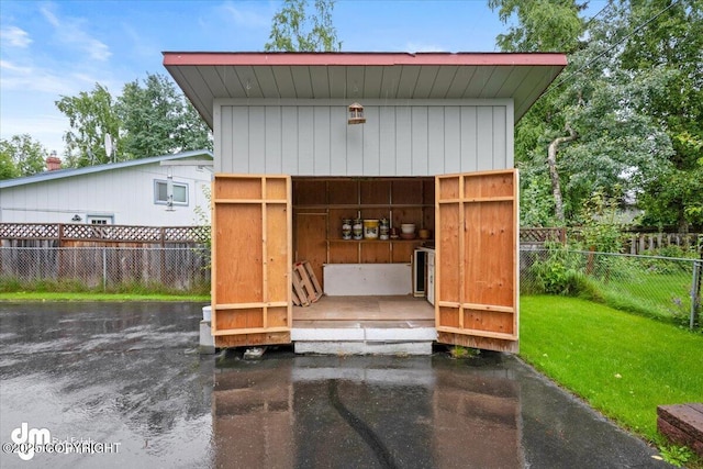 view of outbuilding with an outdoor structure and a fenced backyard