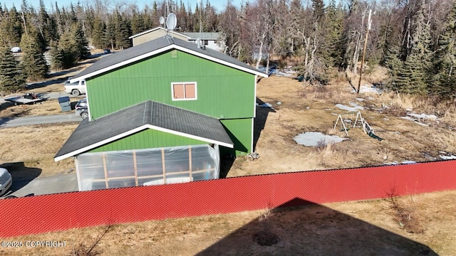 408 Haller St, Kenai, AK 99611 - view of side of property featuring an exterior structure and a forest view