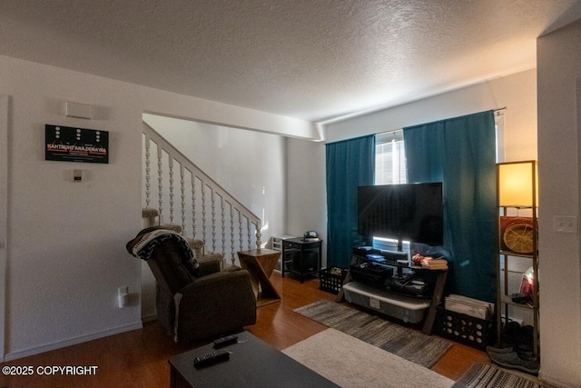408 Haller St, Kenai, AK 99611 - living room with wood finished floors, stairs, and a textured ceiling