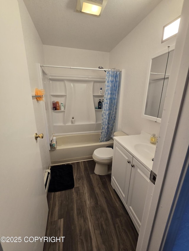 408 Haller St, Kenai, AK 99611 - bathroom featuring wood finished floors, vanity, toilet, shower / bathtub combination with curtain, and a baseboard heating unit