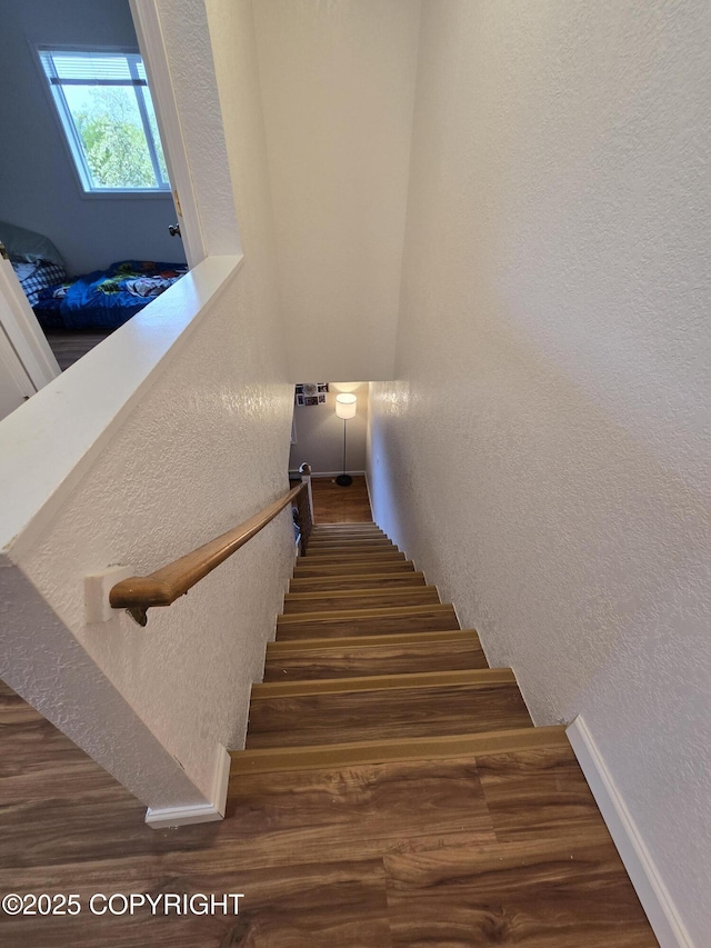 408 Haller St, Kenai, AK 99611 - staircase featuring a textured wall, wood finished floors, and baseboards
