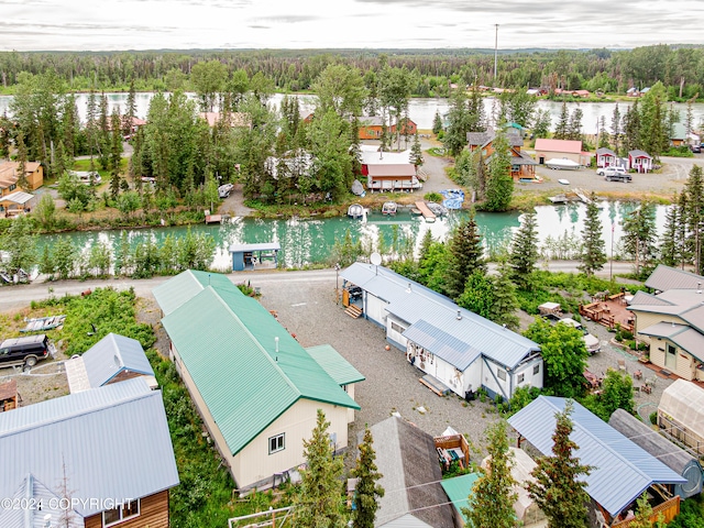 drone / aerial view featuring a water view and a residential view