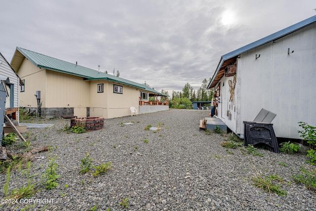 view of side of home with metal roof