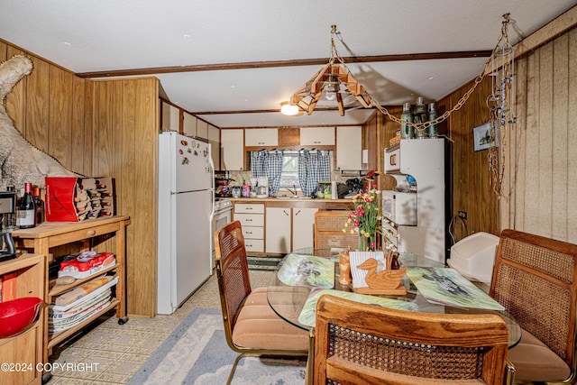 dining area with wooden walls