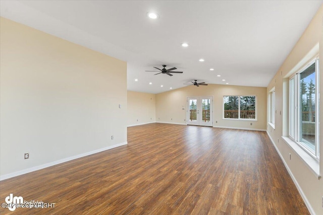 unfurnished living room with lofted ceiling, ceiling fan, recessed lighting, baseboards, and dark wood finished floors