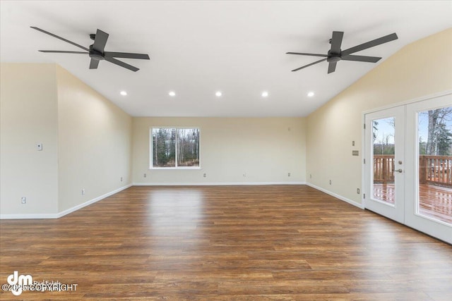 unfurnished living room featuring french doors, recessed lighting, vaulted ceiling, wood finished floors, and baseboards