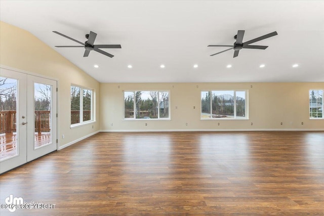 unfurnished living room featuring lofted ceiling, french doors, and a healthy amount of sunlight