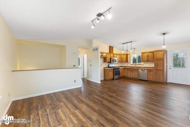 kitchen featuring stainless steel appliances, visible vents, baseboards, vaulted ceiling, and dark wood-style floors