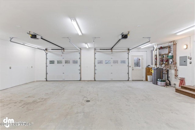 garage featuring a garage door opener and electric panel