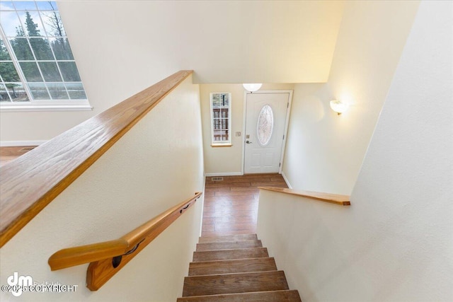 stairway with wood finished floors