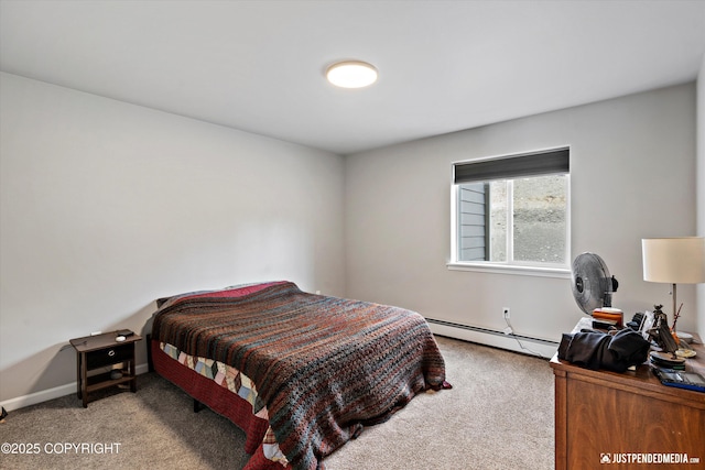 carpeted bedroom featuring baseboards and a baseboard heating unit