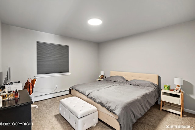 bedroom featuring carpet and a baseboard heating unit