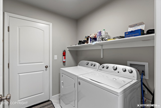 laundry room with marble finish floor, laundry area, and washer and dryer