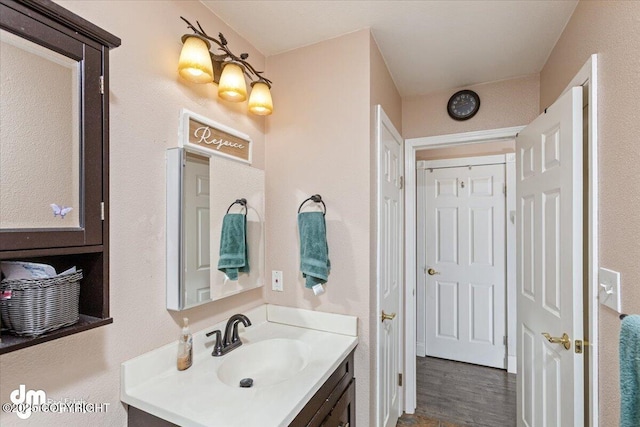 bathroom featuring vanity and wood finished floors