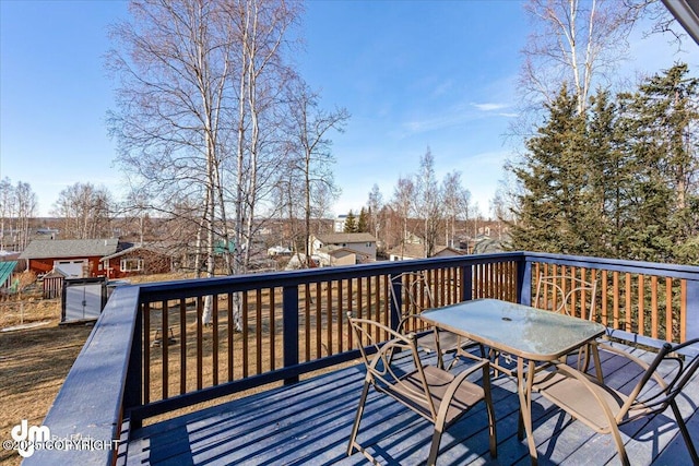 wooden deck featuring outdoor dining area