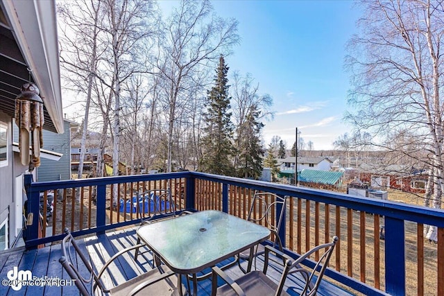 wooden deck with outdoor dining area